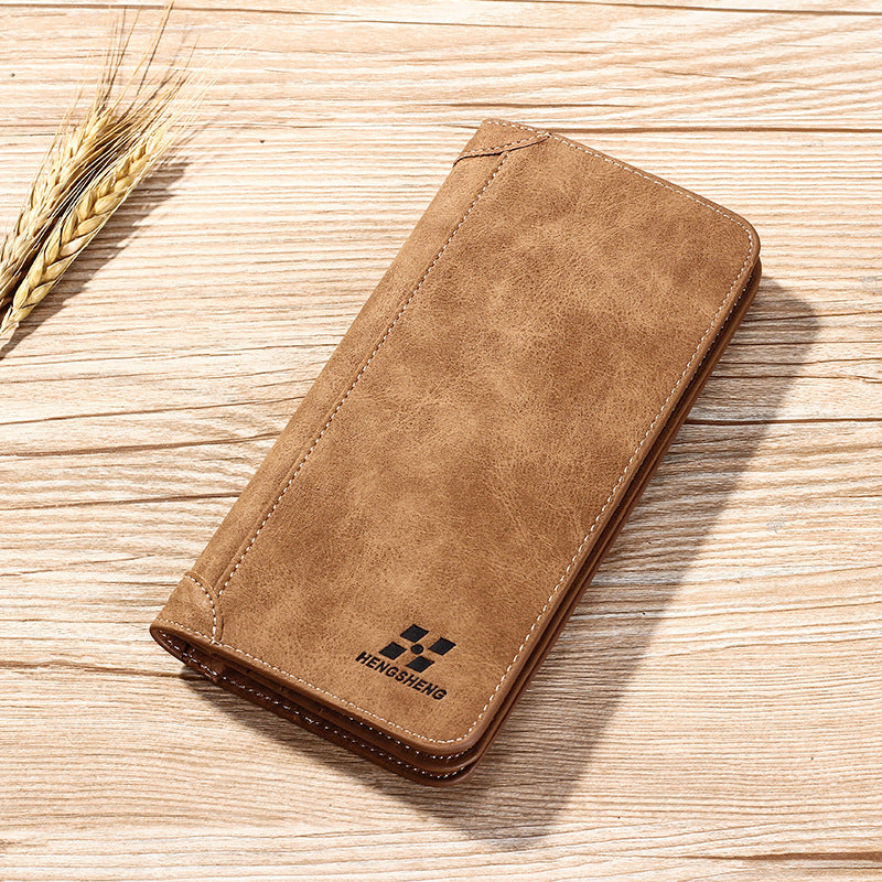 محفظة رجالية طولية (Long Wallet) من ماركة هينجشينج (Hengsheng)، وتتميز بتصميمها الشبابي على النمط الكوري الحديث، ومظهرها الكلاسيكي المطفأ (Frosted Leather) الذي يشبه الجلد المخملي