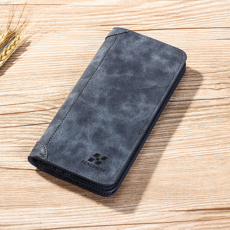 محفظة رجالية طولية (Long Wallet) من ماركة هينجشينج (Hengsheng)، وتتميز بتصميمها الشبابي على النمط الكوري الحديث، ومظهرها الكلاسيكي المطفأ (Frosted Leather) الذي يشبه الجلد المخملي